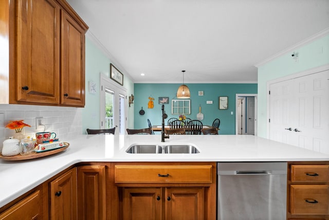 779 Iron Workers Rd W, Clarksville, TN 37043 - kitchen with brown cabinetry, stainless steel dishwasher, a sink, and light countertops