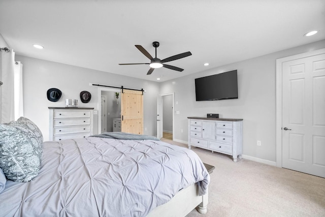779 Iron Workers Rd W, Clarksville, TN 37043 - bedroom featuring light colored carpet, a barn door, baseboards, and recessed lighting