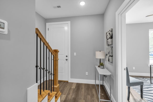 1617 Adams St, Chattanooga, TN 37408 - foyer entrance featuring wood finished floors, baseboards, visible vents, and stairway