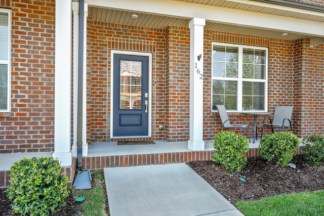 162 Jackson Alan Dr, Murfreesboro, TN 37130 - doorway to property featuring a porch and brick siding