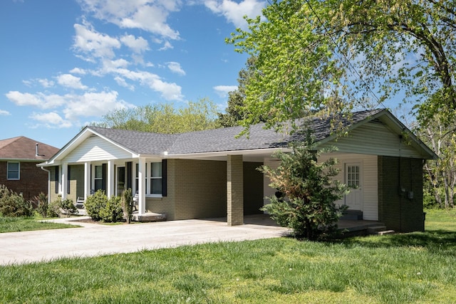 single story home featuring concrete driveway, brick siding, a front lawn, and covered porch