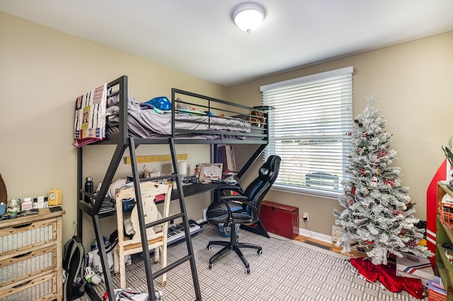 bedroom featuring baseboards