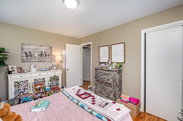 bedroom featuring light wood-style flooring