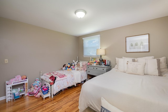 bedroom featuring wood finished floors