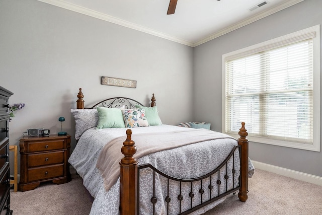 bedroom featuring baseboards, light carpet, crown molding, visible vents, and ceiling fan