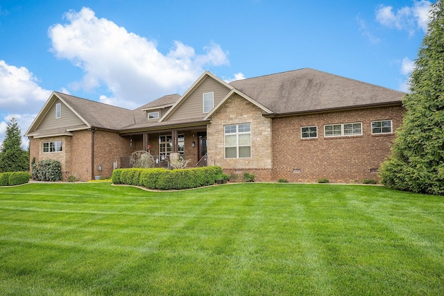 view of front of house featuring brick siding, a shingled roof, crawl space, and a front lawn