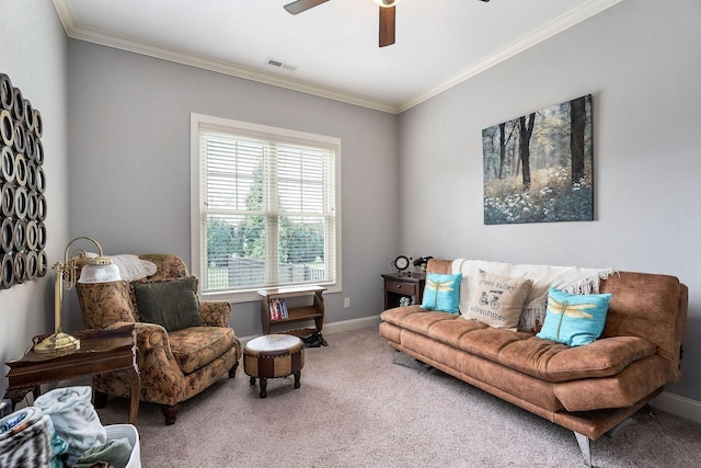 carpeted living room featuring ceiling fan, baseboards, ornamental molding, and visible vents
