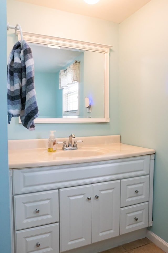 bathroom with tile patterned flooring and vanity