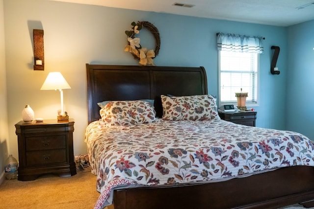 bedroom featuring visible vents and carpet floors