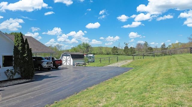 view of road with aphalt driveway