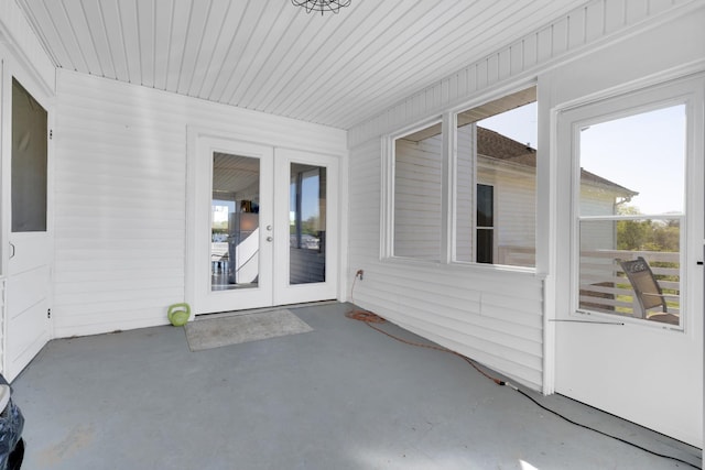 unfurnished sunroom with french doors and a wealth of natural light