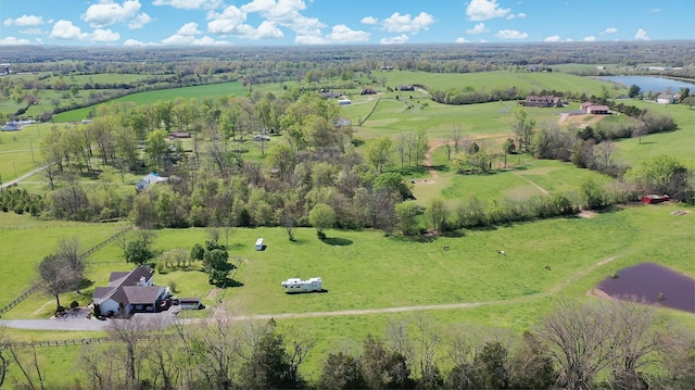 drone / aerial view featuring a water view and a rural view
