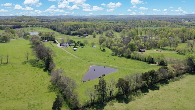 drone / aerial view with a water view, a rural view, and a wooded view