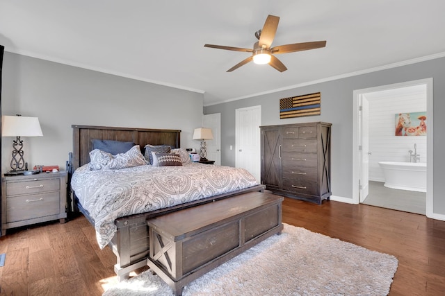 bedroom featuring ensuite bath, a ceiling fan, ornamental molding, wood finished floors, and baseboards