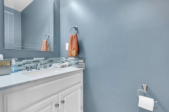 bathroom with vanity and backsplash
