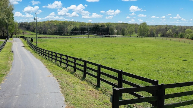 exterior space with a rural view and a forest view