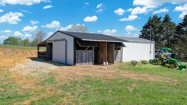 view of pole building with a yard