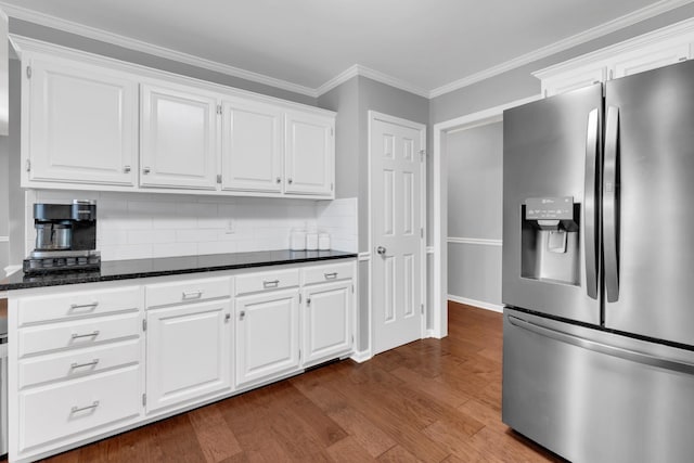 kitchen featuring backsplash, white cabinets, stainless steel refrigerator with ice dispenser, and dark wood finished floors