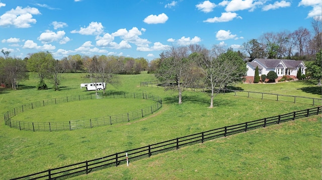 view of yard with a rural view and fence
