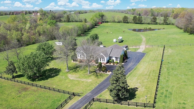 birds eye view of property featuring a rural view and a water view