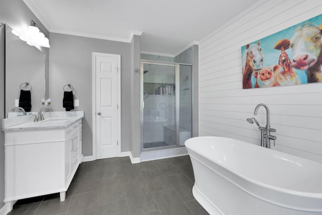 bathroom featuring vanity, crown molding, a stall shower, and a soaking tub