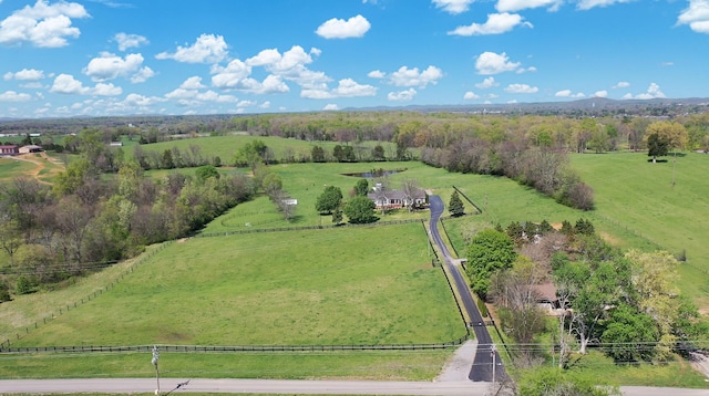 birds eye view of property with a rural view