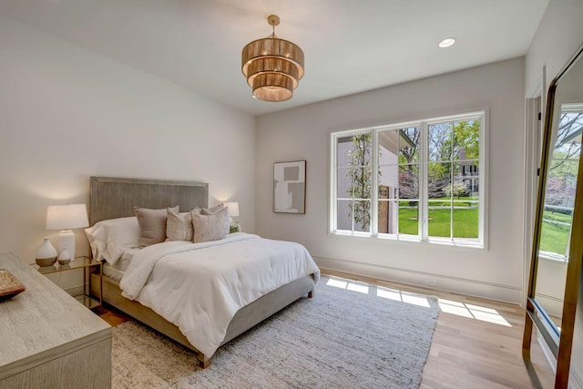 128 Alton Rd, Nashville, TN 37205 - bedroom featuring a chandelier, recessed lighting, light wood-type flooring, and multiple windows
