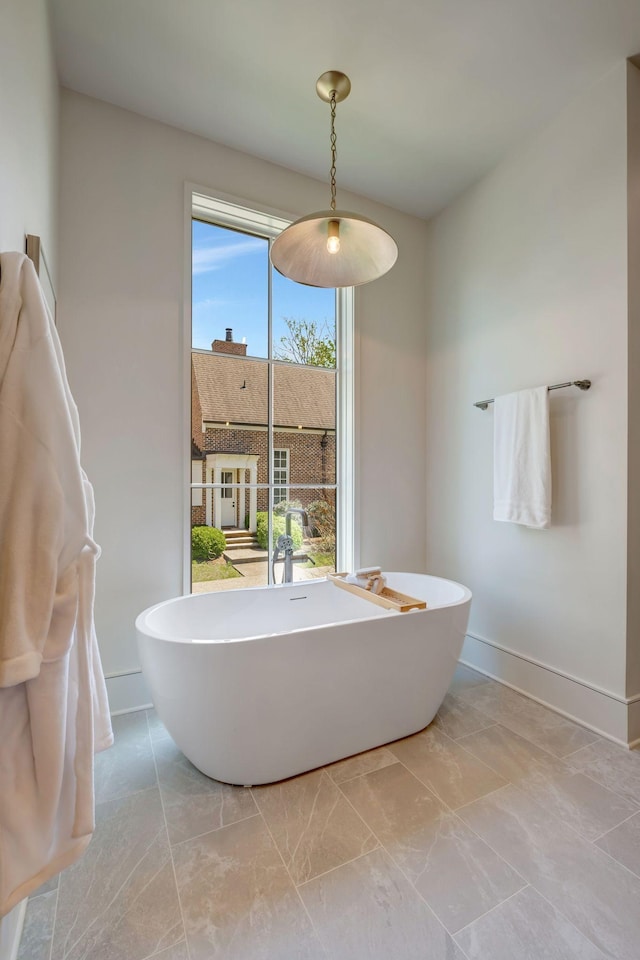 128 Alton Rd, Nashville, TN 37205 - bathroom with a soaking tub, marble finish floor, and baseboards