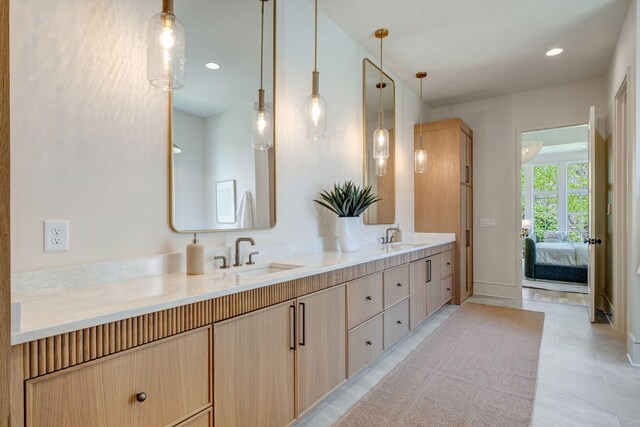 128 Alton Rd, Nashville, TN 37205 - bathroom with baseboards, double vanity, tile patterned floors, ensuite bath, and a sink