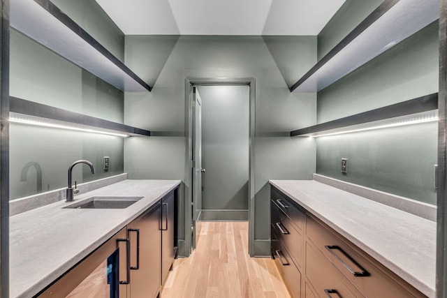 128 Alton Rd, Nashville, TN 37205 - kitchen featuring light wood-style flooring, light countertops, a sink, and open shelves