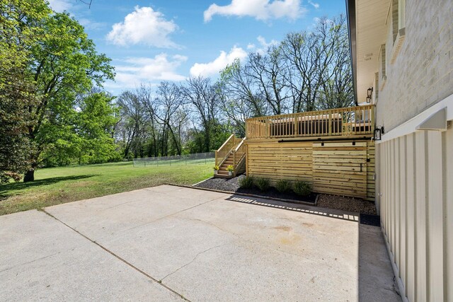 view of patio with a deck and stairs