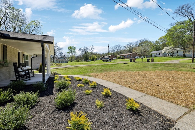 view of yard with a porch