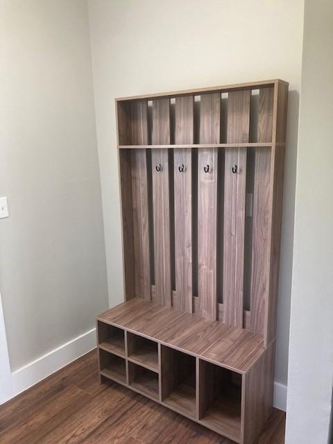 mudroom with baseboards and wood finished floors