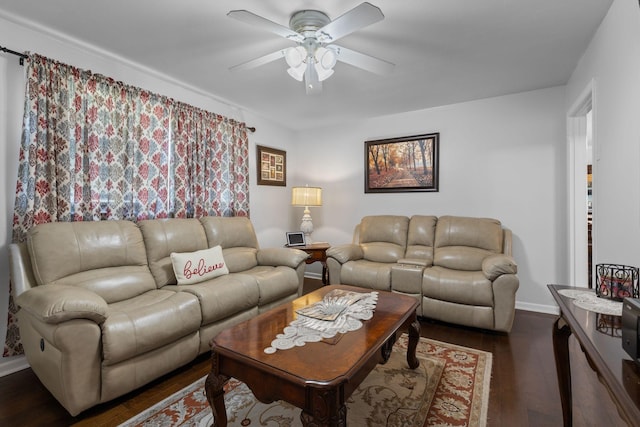 living room with ceiling fan, baseboards, and dark wood finished floors