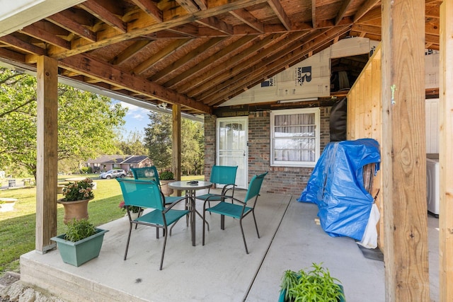 view of patio with washer / clothes dryer and outdoor dining area