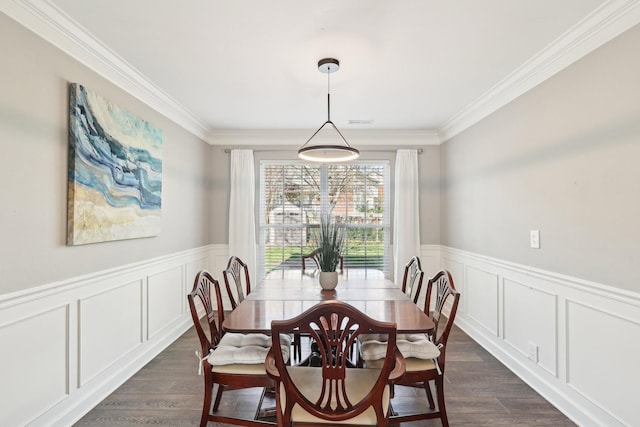 245 Wisteria Dr, Franklin, TN 37064 - dining area with a decorative wall, dark wood-style floors, crown molding, and a wainscoted wall