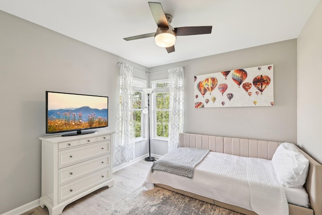 245 Wisteria Dr, Franklin, TN 37064 - bedroom with baseboards, ceiling fan, and light wood-style floors