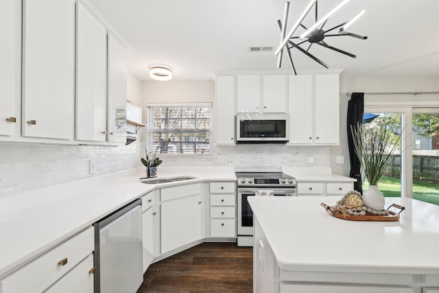 245 Wisteria Dr, Franklin, TN 37064 - kitchen with plenty of natural light, light countertops, visible vents, stainless steel appliances, and a sink