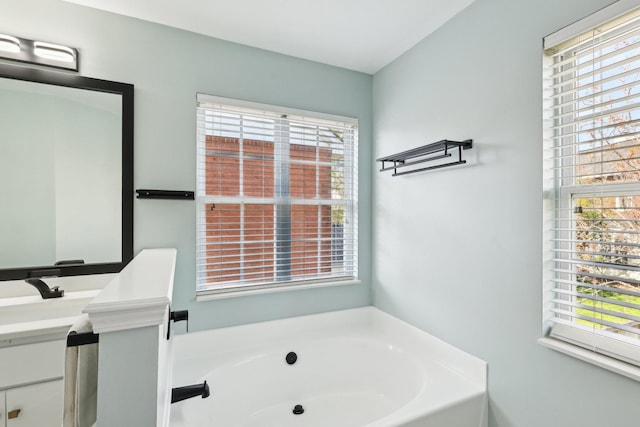 245 Wisteria Dr, Franklin, TN 37064 - bathroom with a bath, vanity, and a healthy amount of sunlight
