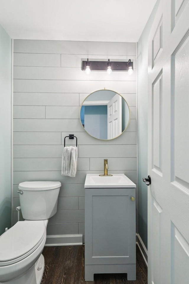 245 Wisteria Dr, Franklin, TN 37064 - half bath with toilet, wood finished floors, vanity, and baseboards