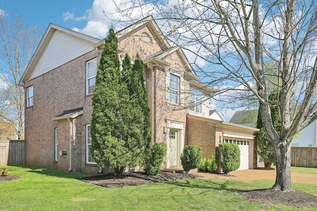 245 Wisteria Dr, Franklin, TN 37064 - traditional-style home with a front yard, fence, brick siding, a garage, and concrete driveway