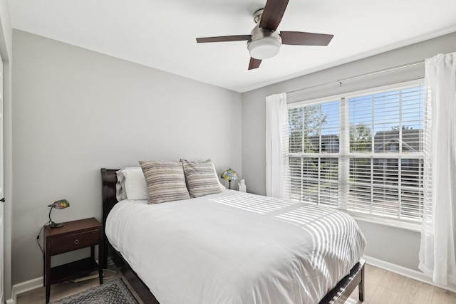 245 Wisteria Dr, Franklin, TN 37064 - bedroom featuring baseboards, a ceiling fan, and wood finished floors