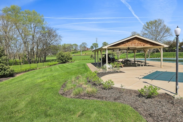 245 Wisteria Dr, Franklin, TN 37064 - view of yard featuring a gazebo, a ceiling fan, a community pool, fence, and a patio