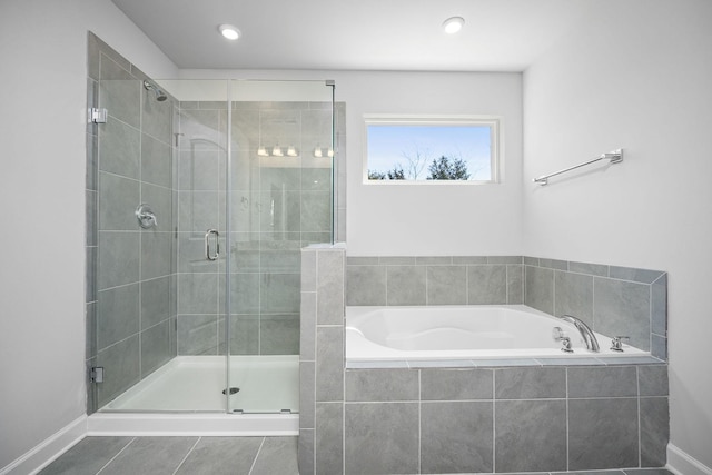 full bath featuring baseboards, tile patterned floors, recessed lighting, a shower stall, and a garden tub