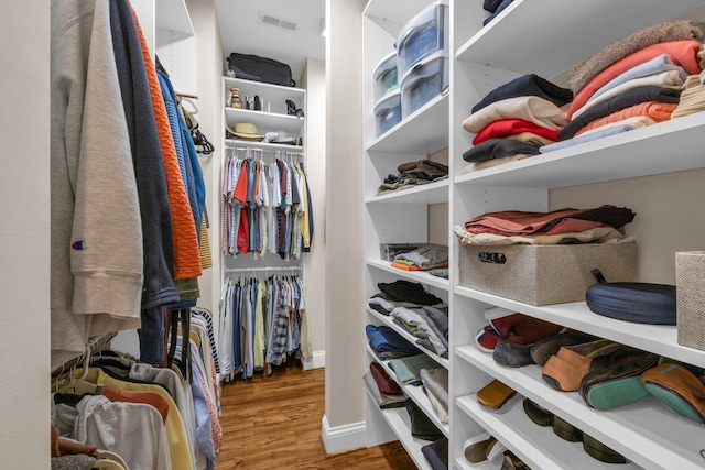 spacious closet with visible vents and wood finished floors