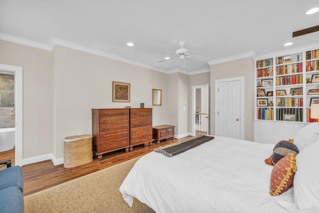 bedroom with ornamental molding, baseboards, recessed lighting, and wood finished floors