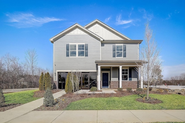 5046 Lawler Ln, Old Hickory, TN 37138 - view of front of house featuring board and batten siding, covered porch, and a front yard