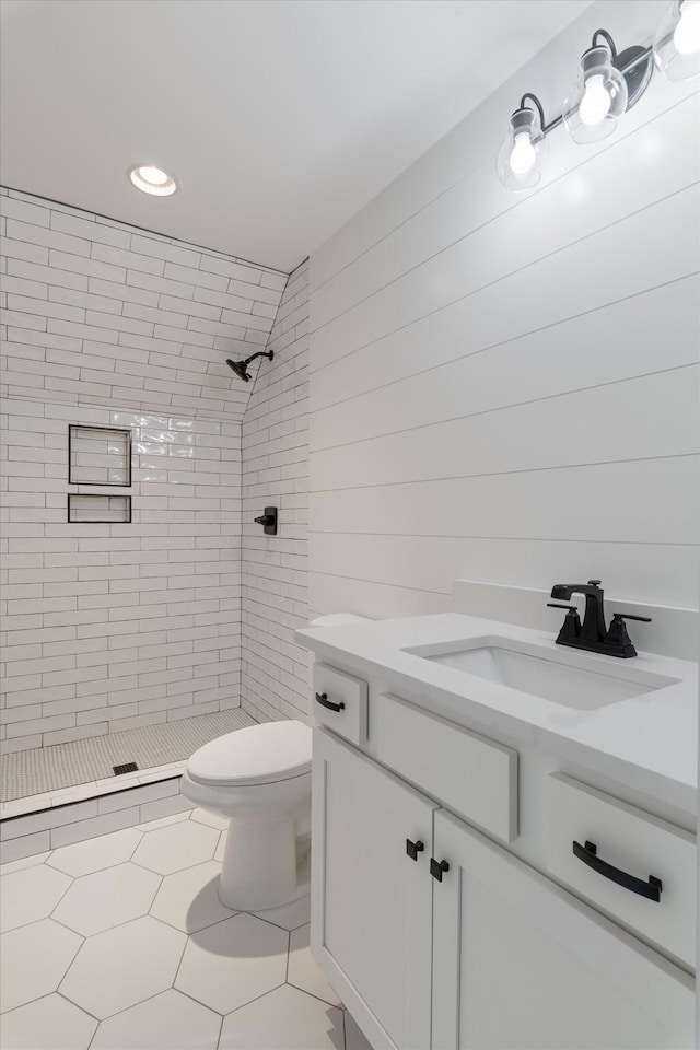 full bathroom with toilet, recessed lighting, vanity, tile patterned flooring, and a stall shower