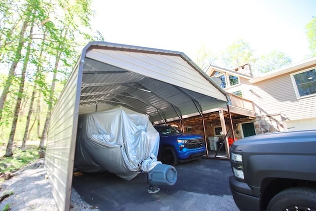 view of parking with a detached carport