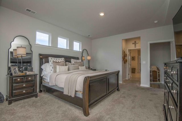 bedroom with light carpet, baseboards, and visible vents
